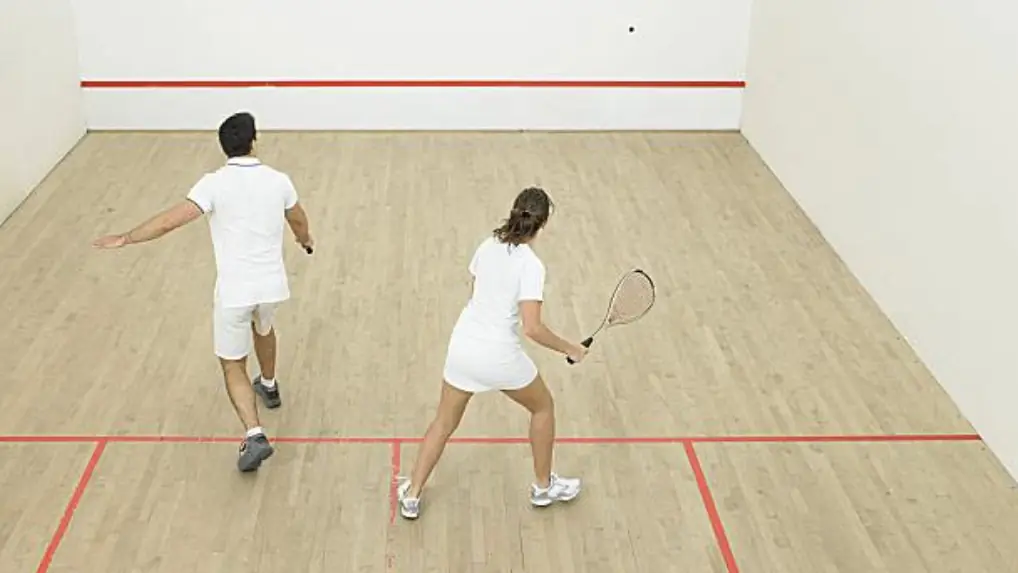 Two squash players in white clothing